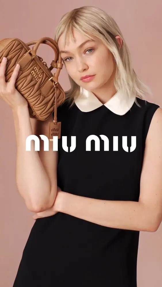 Miu Miu campaign with model and brown designer bag